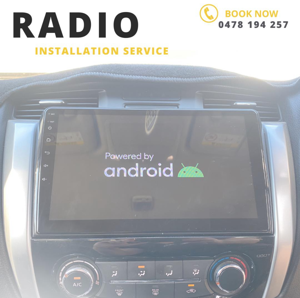 An Android head unit fitted into a ute dashboard, on the business's own radio installation graphic