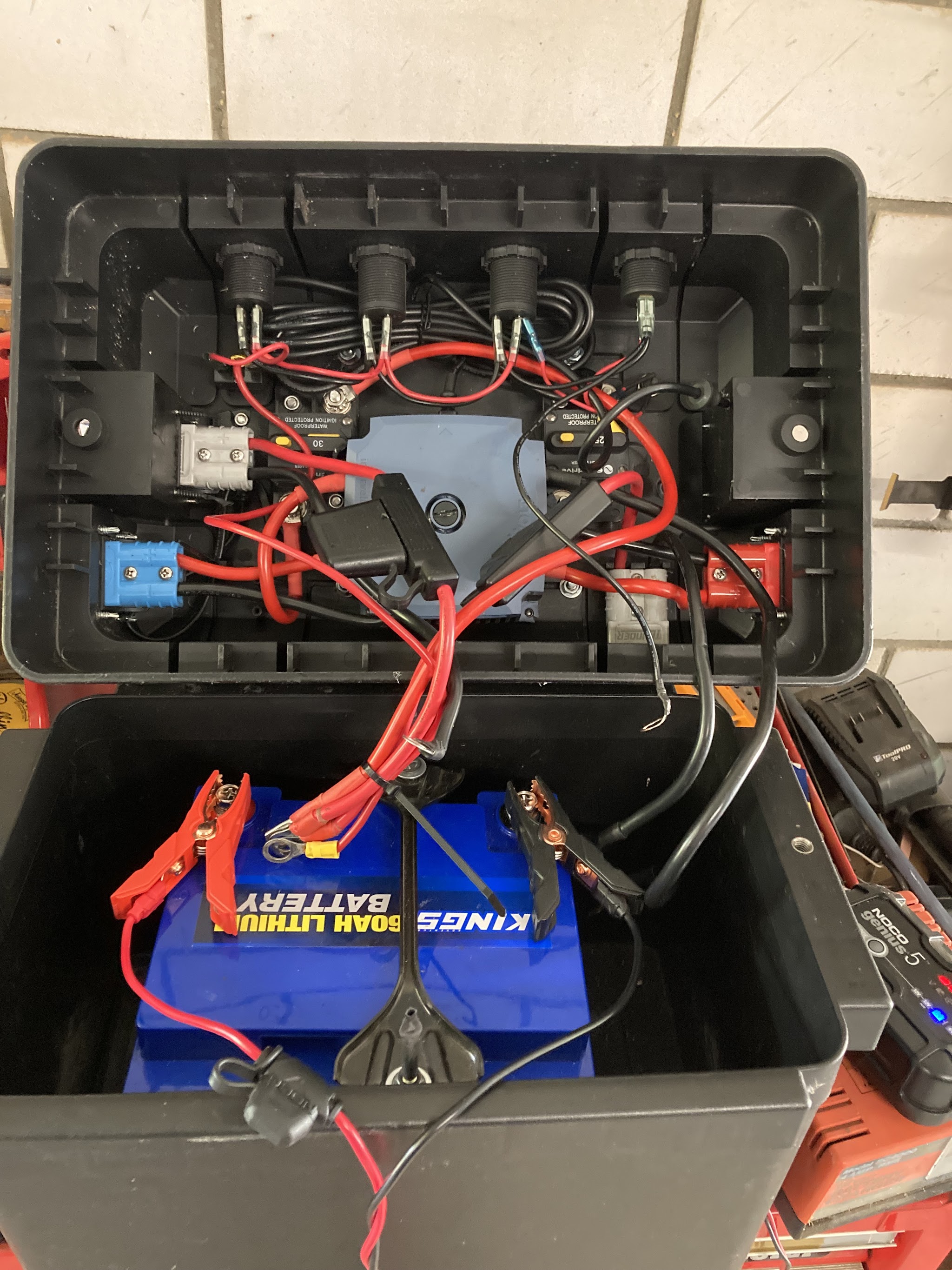 A portable battery box build with Anderson plugs, fused circuits and a lithium battery inside